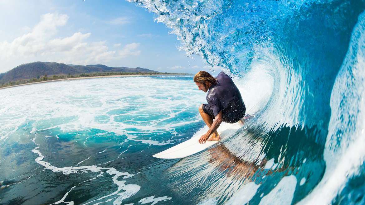 Surfer on Blue Ocean Wave