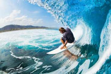 Surfer on Blue Ocean Wave